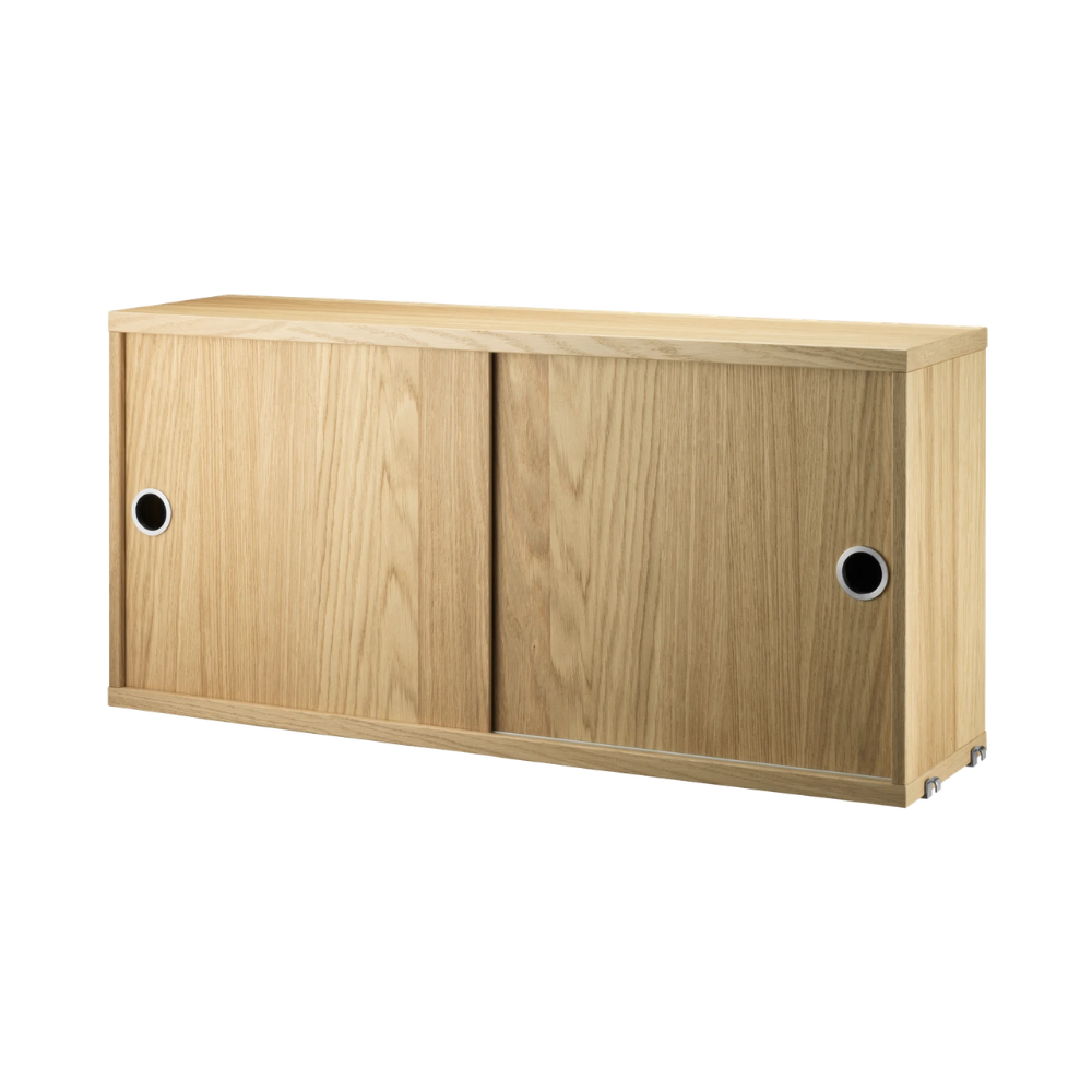 The Cabinet with Sliding Doors from String Furniture in the 7.8 inch depth size and oak color.