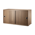 The Cabinet with Sliding Doors from String Furniture in the 11.8 inch depth size and walnut color.