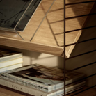 The String System by String Furniture dark brown panels with oak shelves.