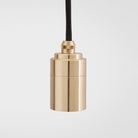 The brass detailing of the Triple Pendant in Brass + Sphere IV by Tala US. all-groups