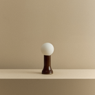 The Shore Table lamp from Tala Lighting in Brown turned off.