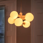 The Echo Chandelier by Tala Lighting in a living room.