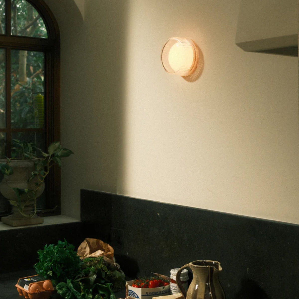 The Firth Wall Light by Tala Lighting in a kitchen.