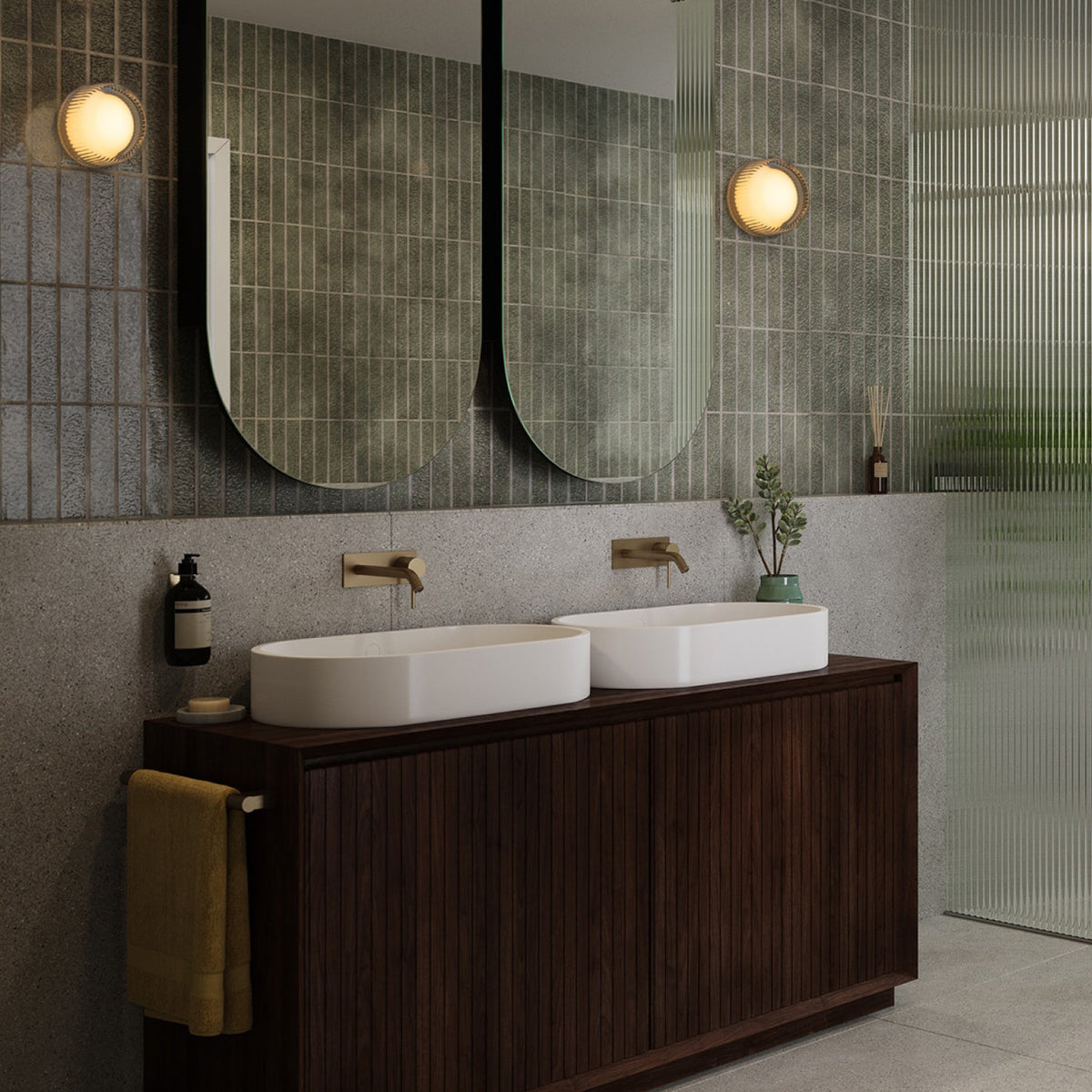 The Firth Wall Light by Tala Lighting installed on either side of vanity mirror.