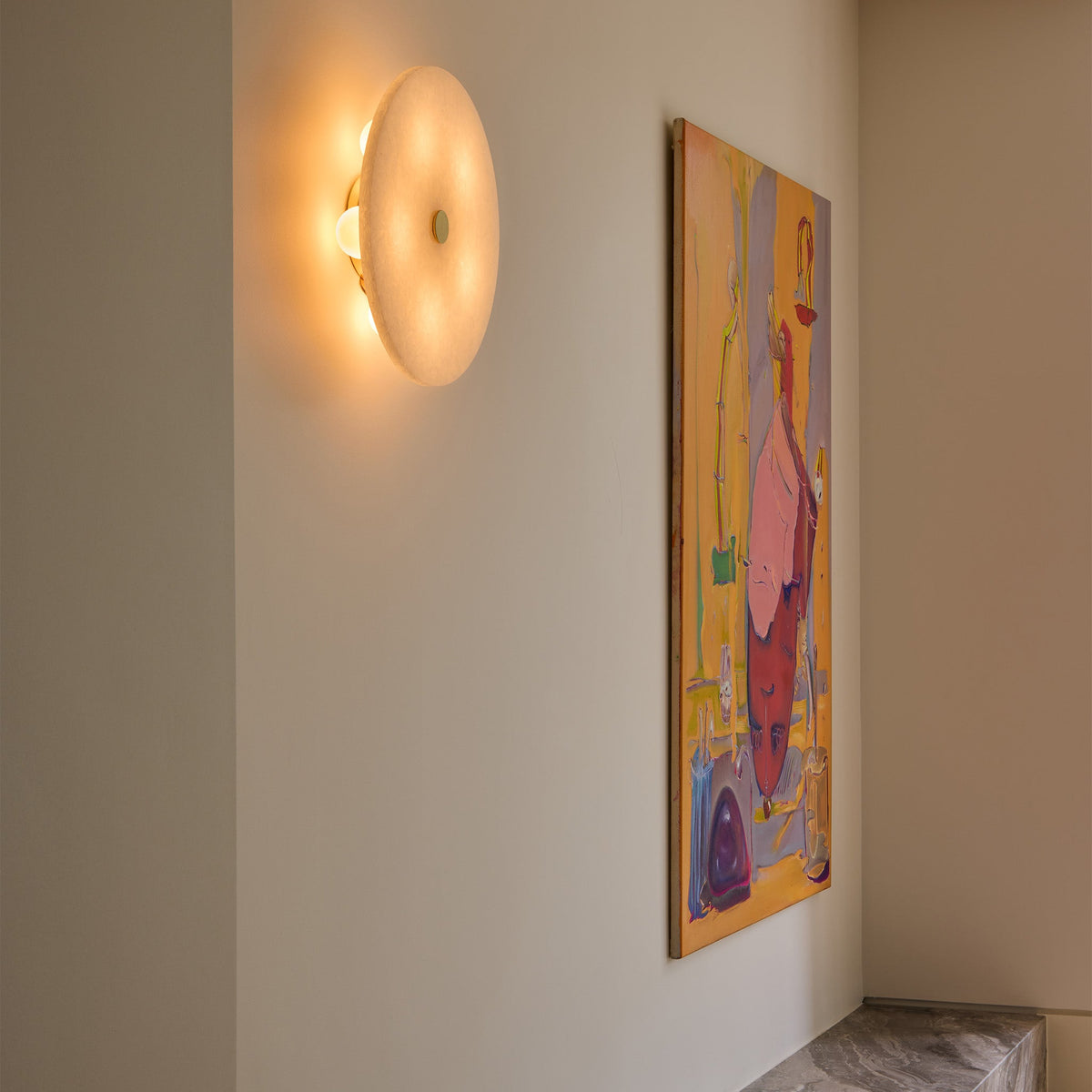 The Magma G70 6W Replacement Bulb in the Magma fixture in a living room.