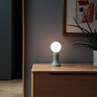 The Shore Table Lamp from Tala Lighting in Sea Green on a sideboard.