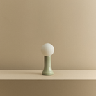 The Shore Table Lamp from Tala Lighting in Sea Green turned off.
