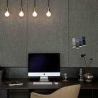 The Sphere II E26 Dim-to-Warm LED Bulb by Tala Lighting with brass pendant in an office.