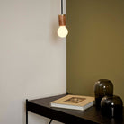 The Sphere II E26 Dim-to-Warm LED Bulb by Tala Lighting with Oak Pendant base.