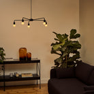 The Sphere I E26 Dim-to-Warm LED Bulb by Tala Lighting in a chandelier base.