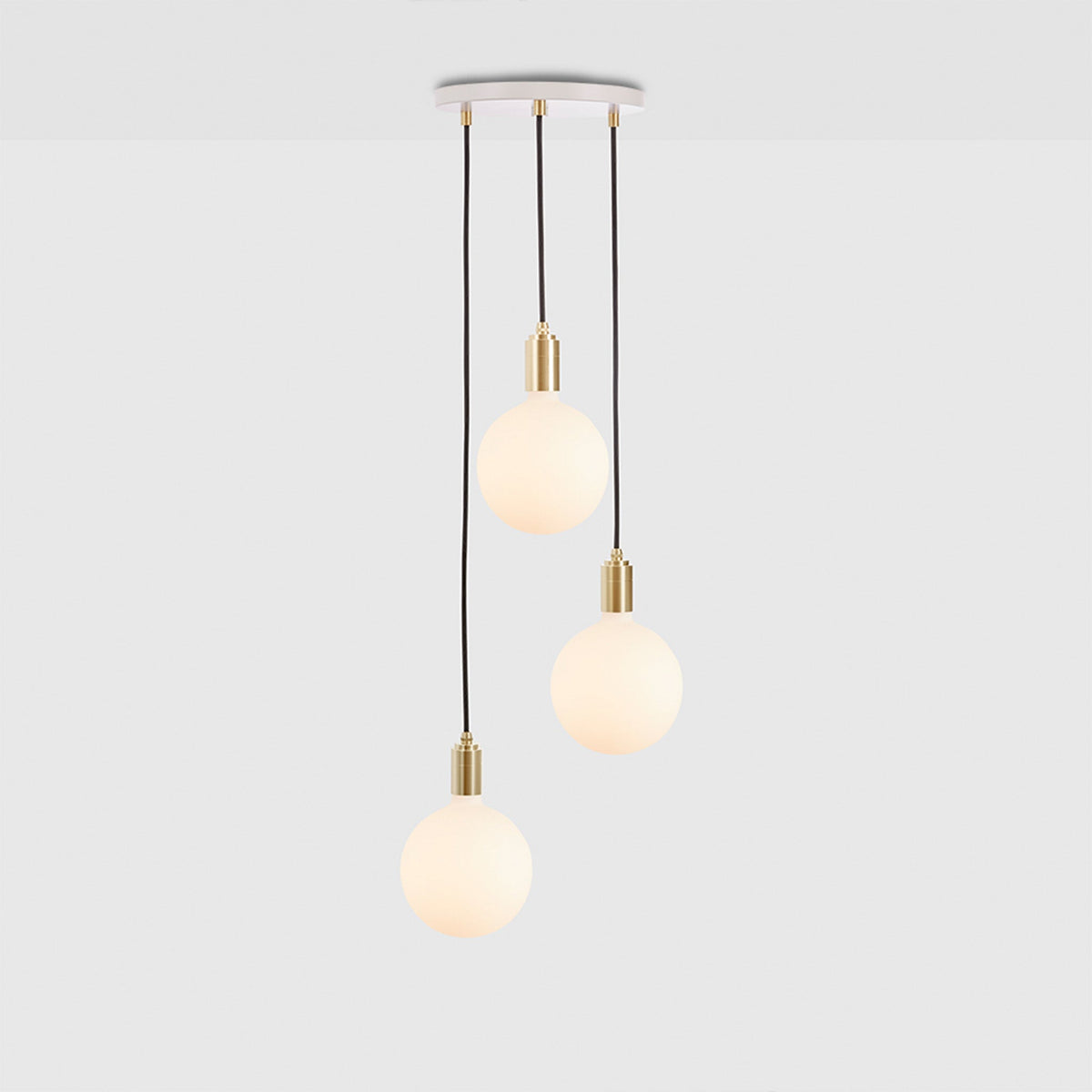 The Triple Pendant in Brass + Sphere IV with White canopy by Tala US.
