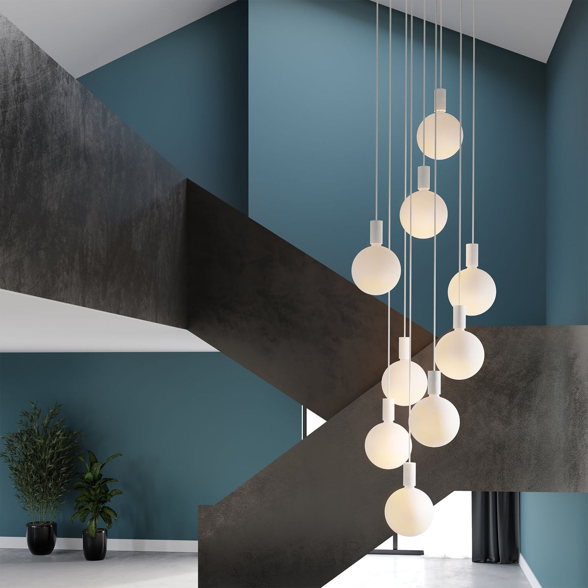 The Alumina Nine Pendant with Sphere V bulbs by Tala Lighting in a modern space.