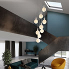 A Cluster pendant with the Sphere V E26 Dim-to-Warm LED Bulb by Tala Lighting.