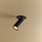 The Core Recessed Spotlight + T50 Light Engine by Tala Lighting in Black turned on.