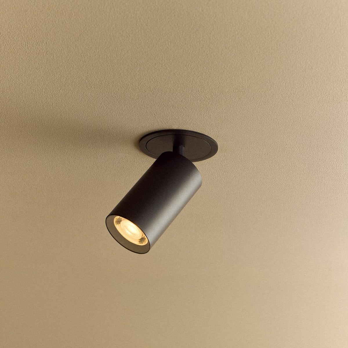 The Core Recessed Spotlight + T50 Light Engine by Tala Lighting in Black turned on.