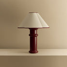 The Heath Table Lamp by Tala Lighting in Port Red turned off.
