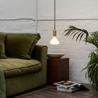 The Noma E26 LED Bulb by Tala Lighting in a living room.