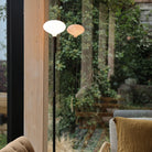 The Oval II E26 LED Bulb by Tala Lighting in a floor lamp in a living room.