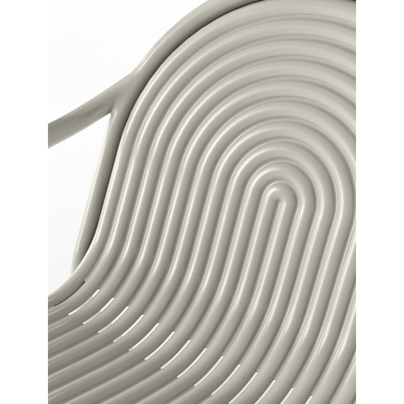 Detailed view of the Groove Outdoor Lounge Chair by Tom Dixon in Putty.