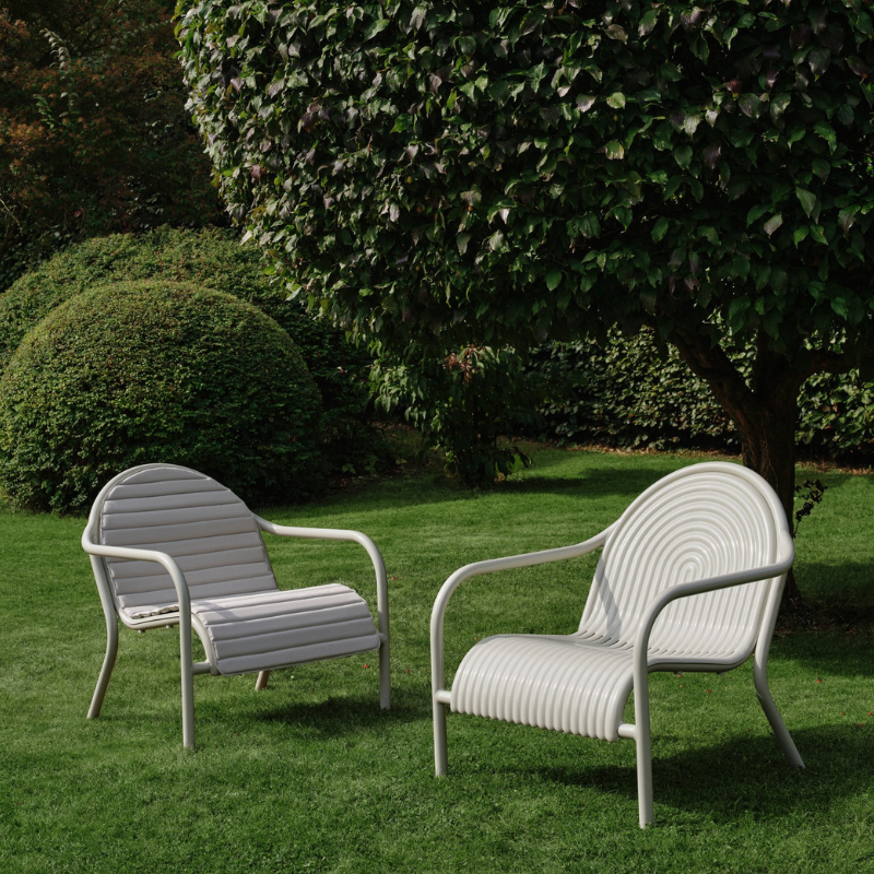 The Groove Outdoor Lounge Chair by Tom Dixon in Putty with and without the matching seat cushion