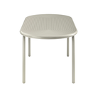 Groove Large Oval Outdoor Table in Putty by Tom Dixon from the side.