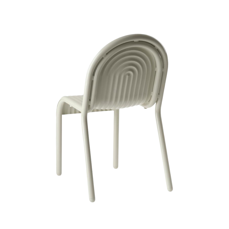 Rear angle view of the Groove Arm Dining Chair in Putty by Tom Dixon.