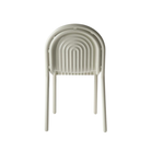 Rear view of the Groove Side Dining Chair in Putty by Tom Dixon.