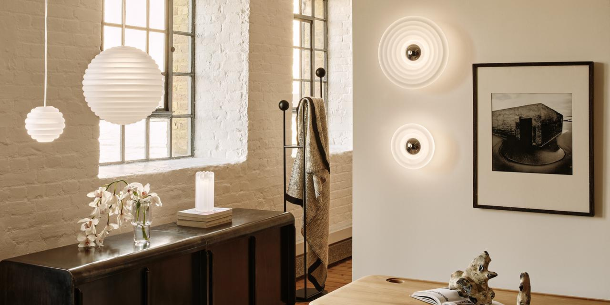 A collection of Tom DIxon lights within a home.