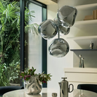 The Melt LED Mini Chandelier from Tom Dixon in Chrome over a dining room table.