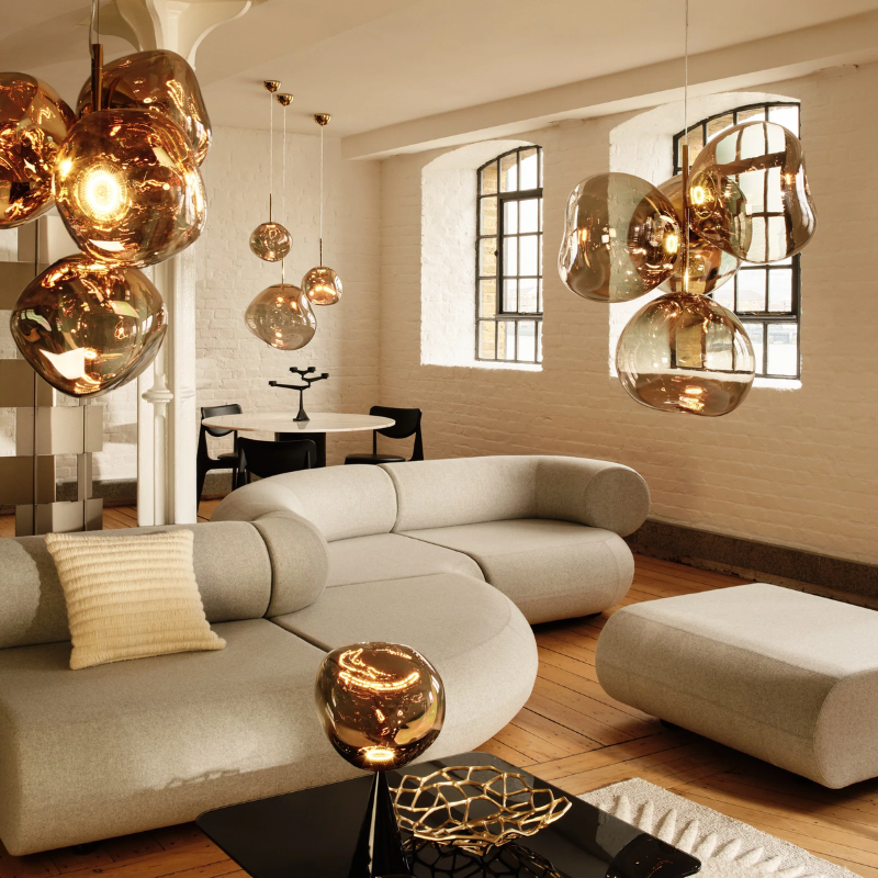 The Melt Collection from Tom Dixon in Bronze shown in a home.