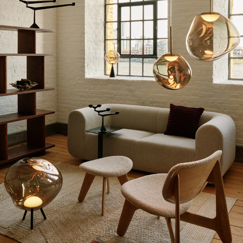 The Melt Collection from Tom Dixon in Bronze shown in a residence. 