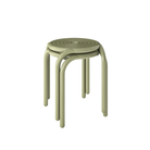 Set of two stacked Groove Outdoor Stools in Moss by Tom Dixon.