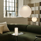 Tom Dixon Press Frosted Medium and Mini Sphere Pendants in a living room.