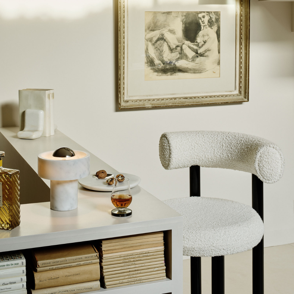 The Stone Portable Light by Tom Dixon in Silver on a bar.