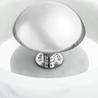 The silver diffuser of the Stone Portable Light by Tom Dixon. all-groups
