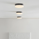 The Cirque Flush Mount from Visual Comfort and Co in a living room.