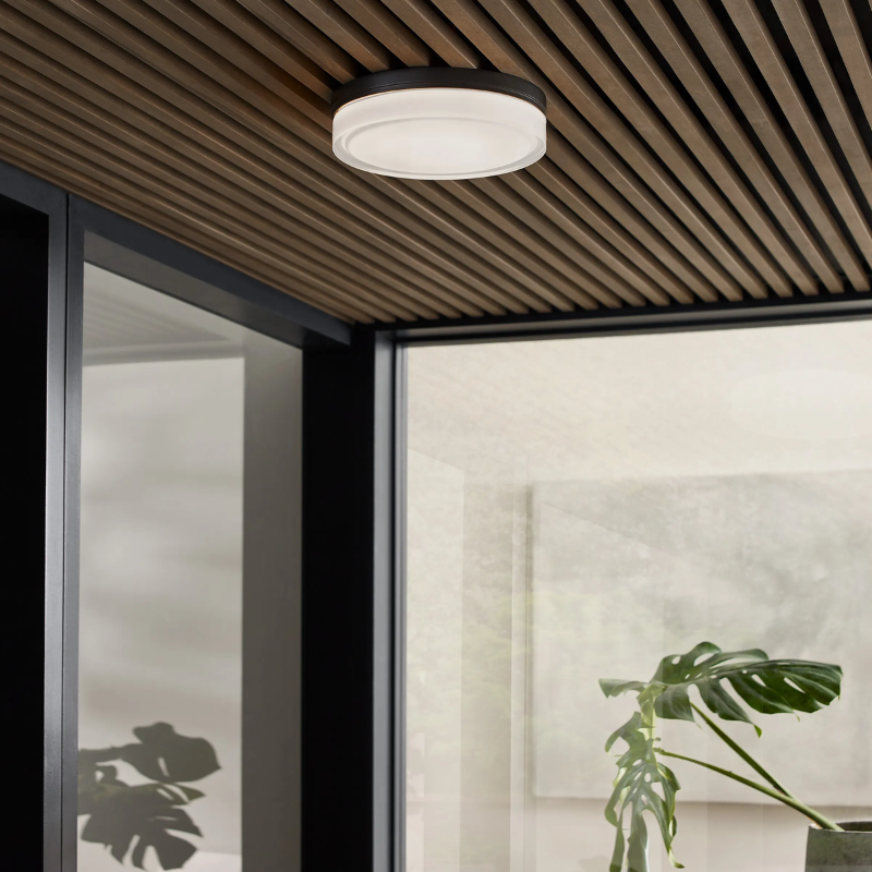 The Cirque Outdoor Flush Mount from Visual Comfort and Co in a lounge area.