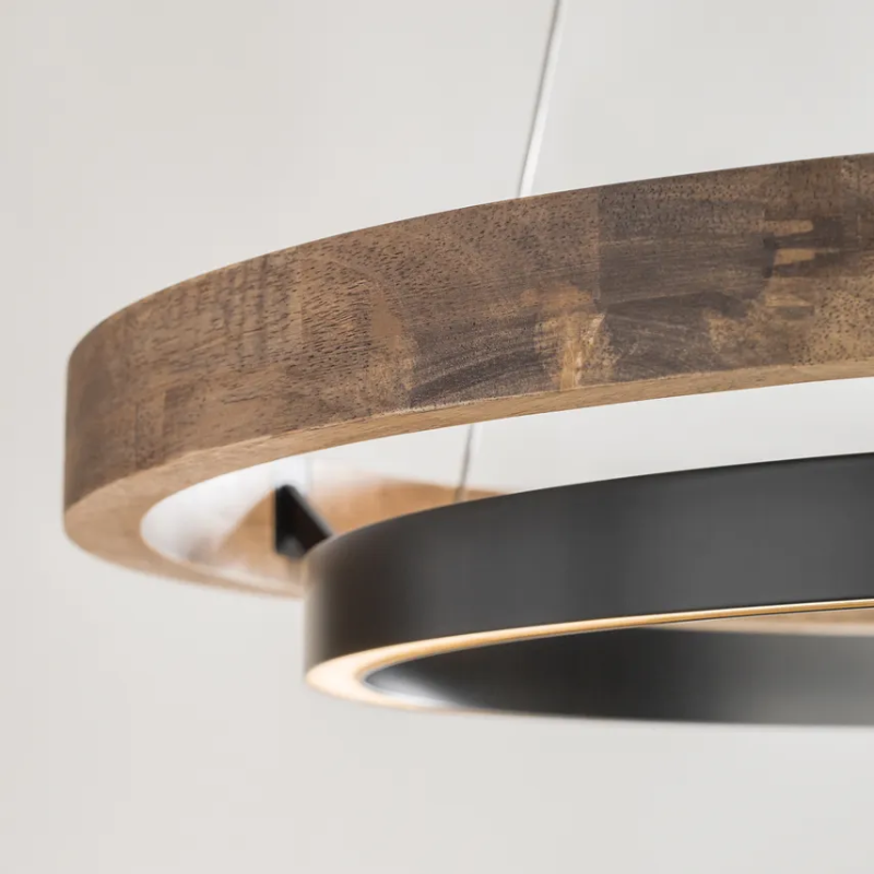 The Grace Chandelier by Sean Lavin is designed with two rings that illuminate this contemporary chandelier. A large outer ring provides organic texture while complemented by a decorative inner ring, housing gently diffused upward and downward LEDs.