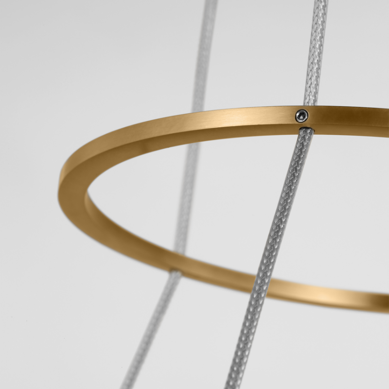 The Grace Chandelier by Sean Lavin is designed with two rings that illuminate this contemporary chandelier. A large outer ring provides organic texture while complemented by a decorative inner ring, housing gently diffused upward and downward LEDs.