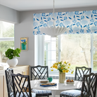 The Hampton Medium Chandelier from Visual Comfort and Co in plaster white in a dining area.