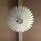 The Hampton Medium Chandelier from Visual Comfort and Co in plaster white in a family space.