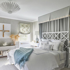 The Hampton Medium Chandelier from Visual Comfort and Co in plaster white in a guest bedroom.