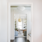 The Hampton Medium Chandelier from Visual Comfort and Co in plaster white in a living space.