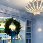 The Hampton Mini Chandelier from Visual Comfort and Co in plaster white in a dining room