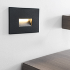 The Ikon Outdoor Step Light from Visual Comfort and Co in a lounge lifestyle photograph.