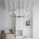 The Piaf Grande Chandelier from Visual Comfort & Co. in aged iron and ebonized oak in a family space.