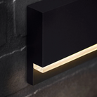 The Wend Outdoor Step Light from Visual Comfort and Co in a lounge.
