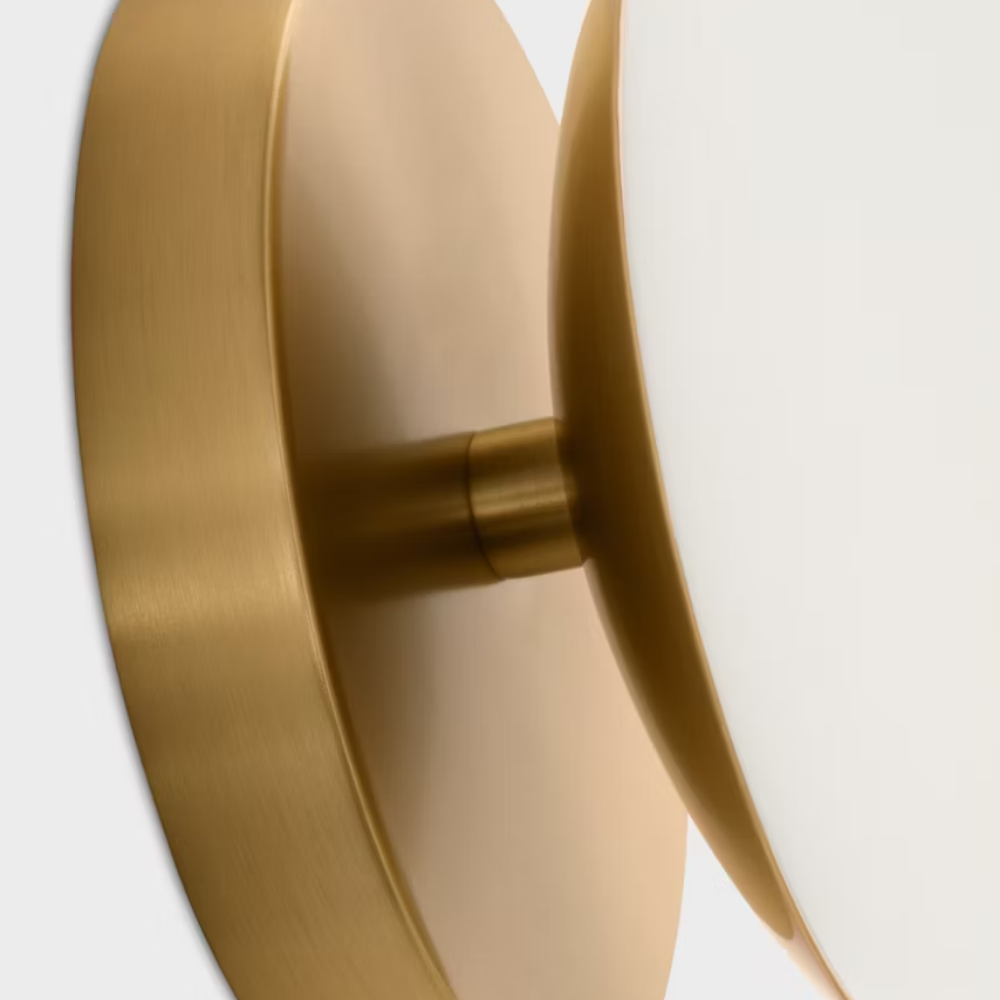 The Lune 1-Light Bath Sconce from Visual Comfort & Co in Burnished Brass up close.