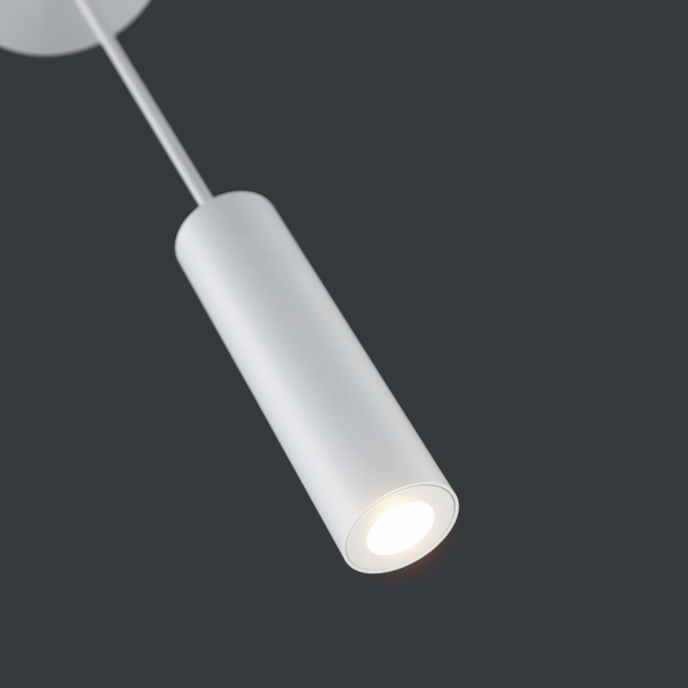 The white Caliber Mini Pendant from WAC Lighting in a living room.