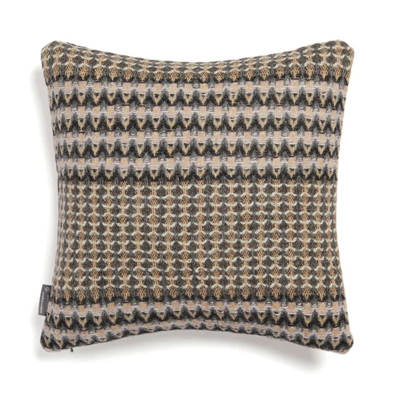 The Ansel Cushion by Wallace & Sewell is made of 100% shetland wool.
